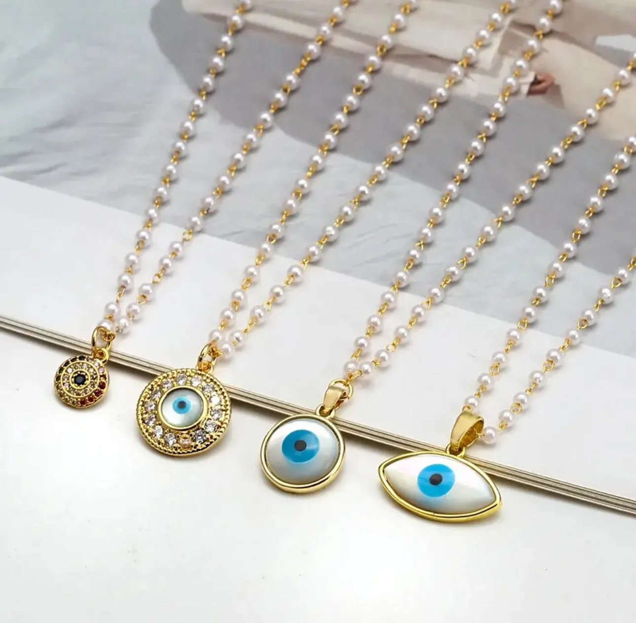 Evil Eye Pendants in dainty Faux pearl chain necklace | Erika Williner Designs
