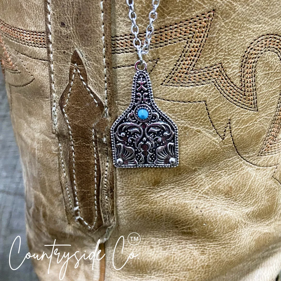Tooled Silver & Turquoise Accent Cowtag Necklace