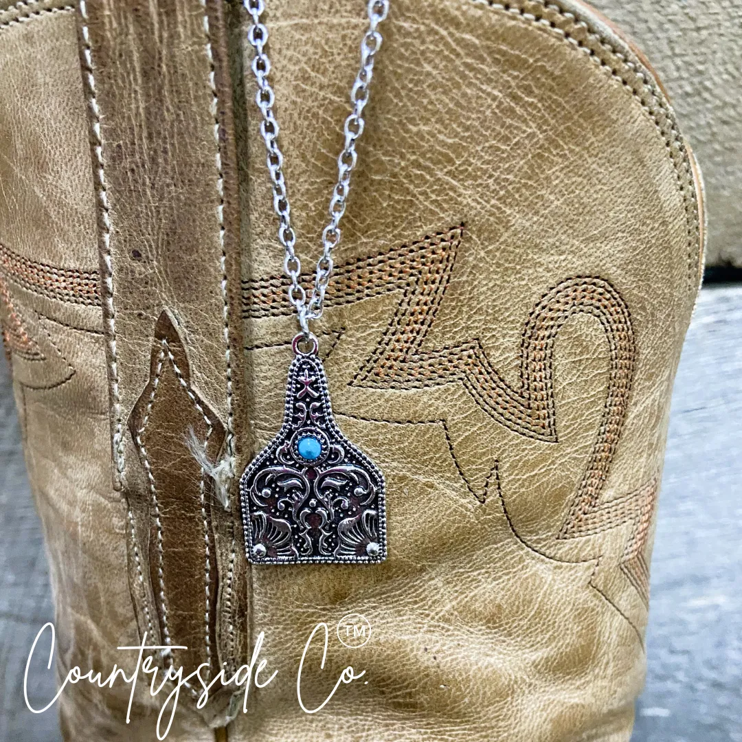 Tooled Silver & Turquoise Accent Cowtag Necklace