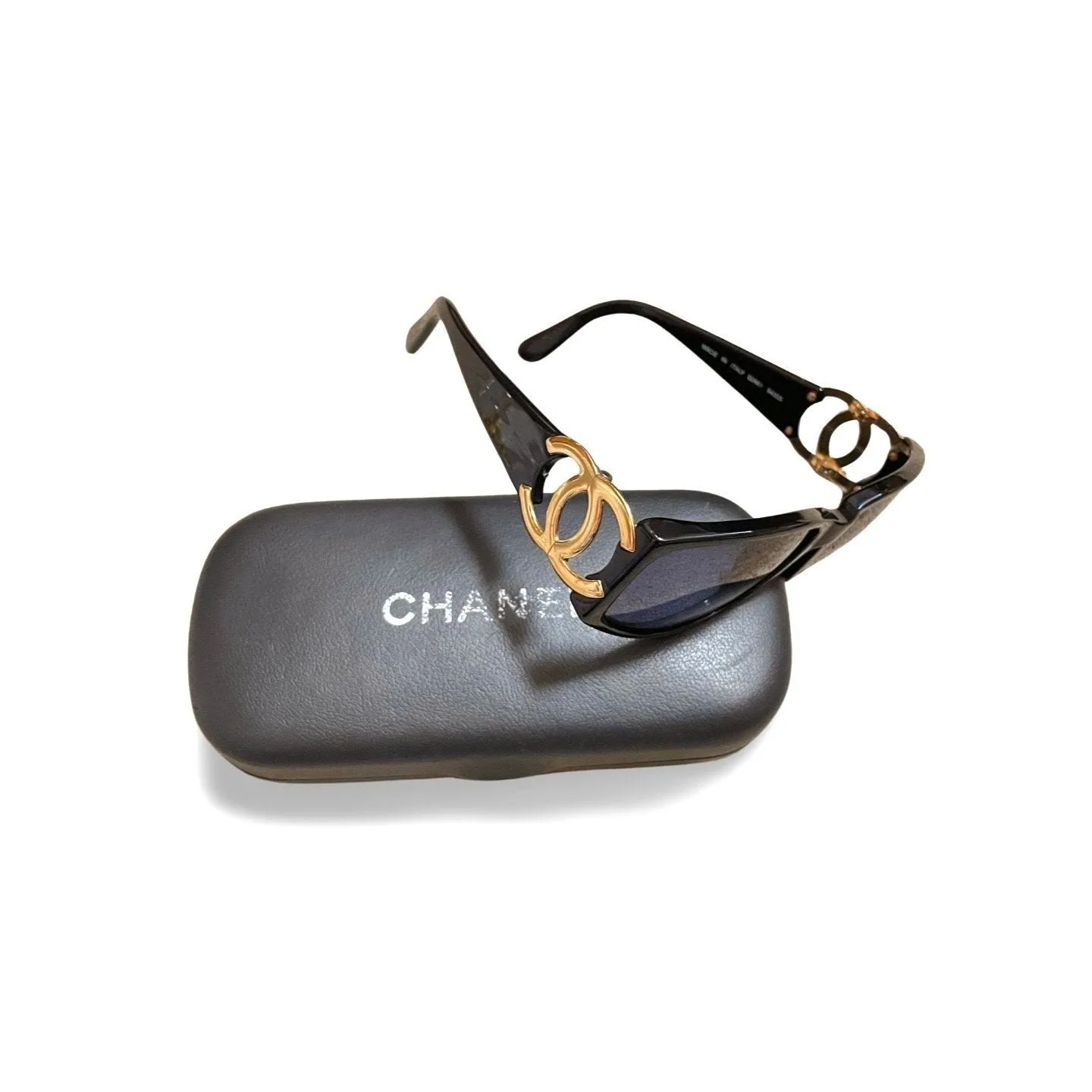 Vintage CHANEL black frame sunglasses with large CC motifs at sides. Mod and chic eyewear you must get. 060521ac4