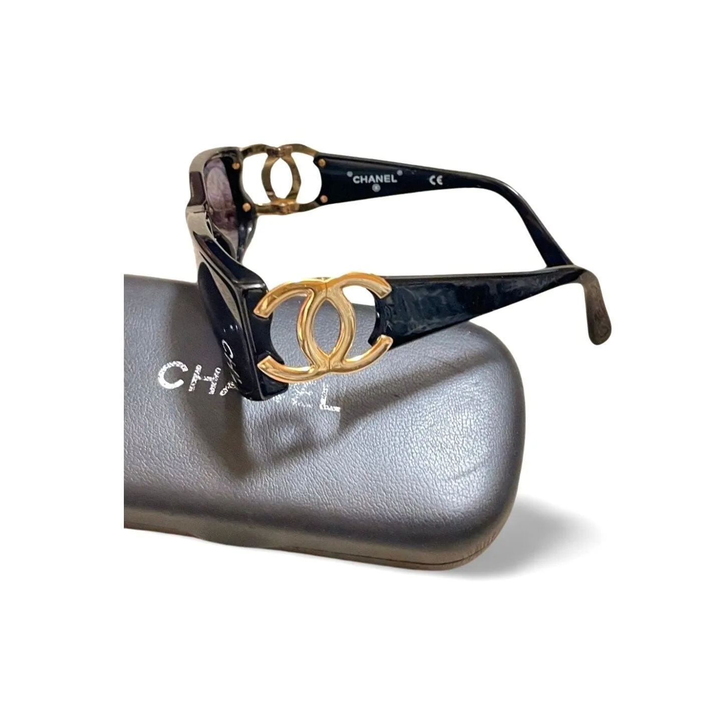 Vintage CHANEL black frame sunglasses with large CC motifs at sides. Mod and chic eyewear you must get. 060521ac4